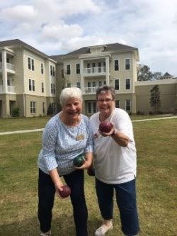 ladies outdoors with bocce balls